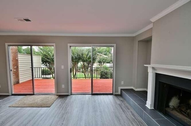 6500 Gaines Ferry Rd Unit A2, Flowery Branch, GA 30542 - doorway with wood finished floors, ornamental molding, a fireplace, and baseboards