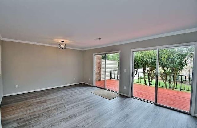 6500 Gaines Ferry Rd Unit A2, Flowery Branch, GA 30542 - unfurnished room with wood finished floors, baseboards, ornamental molding, and a chandelier
