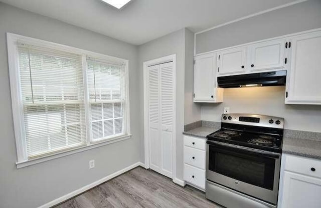 6500 Gaines Ferry Rd Unit A2, Flowery Branch, GA 30542 - kitchen featuring electric stove, under cabinet range hood, wood finished floors, and white cabinetry