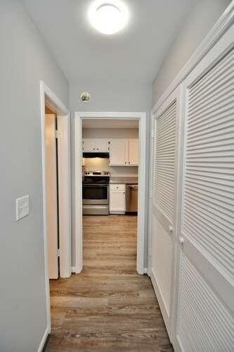 6500 Gaines Ferry Rd Unit A2, Flowery Branch, GA 30542 - corridor featuring light wood-style floors