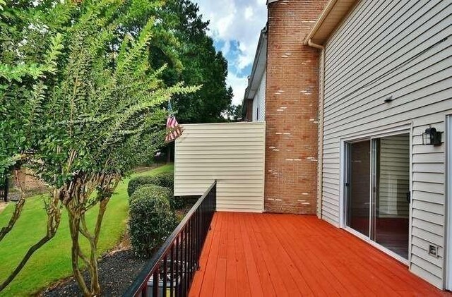 6500 Gaines Ferry Rd Unit A2, Flowery Branch, GA 30542 - view of wooden deck