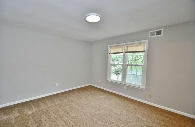 6500 Gaines Ferry Rd Unit A2, Flowery Branch, GA 30542 - carpeted empty room with baseboards