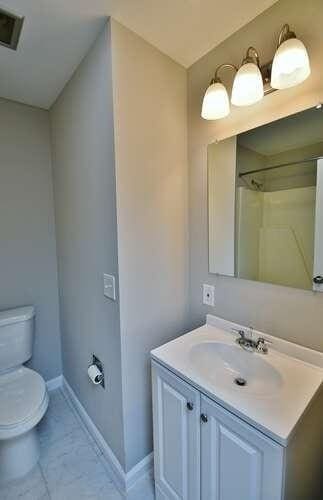 6500 Gaines Ferry Rd Unit A2, Flowery Branch, GA 30542 - full bath with toilet, vanity, baseboards, and tile patterned floors