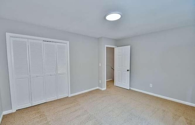 6500 Gaines Ferry Rd Unit A2, Flowery Branch, GA 30542 - unfurnished bedroom with carpet floors, a closet, and baseboards