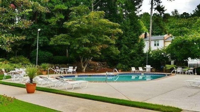 6500 Gaines Ferry Rd Unit A2, Flowery Branch, GA 30542 - community pool featuring a patio area