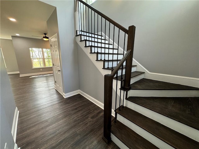 stairway featuring hardwood / wood-style floors and ceiling fan