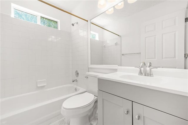 bathroom with toilet, vanity, and shower / bathing tub combination