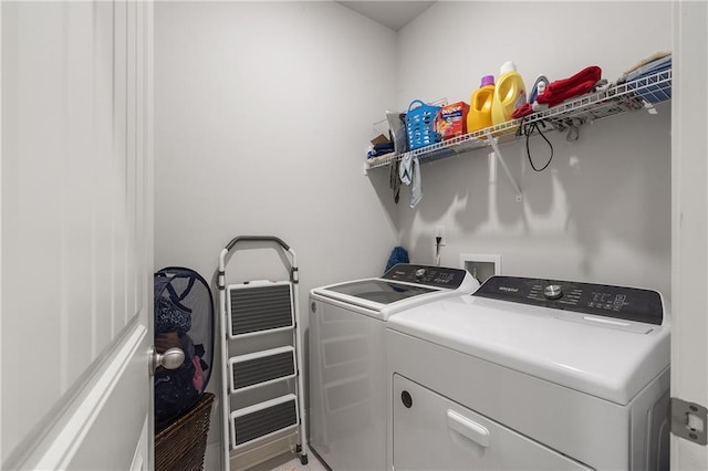 laundry area with laundry area and washing machine and clothes dryer