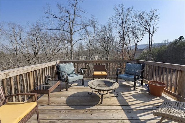 wooden deck featuring an outdoor hangout area