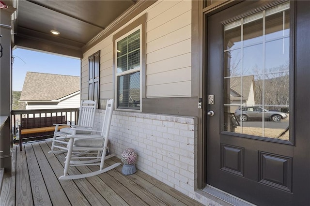 wooden terrace with a porch