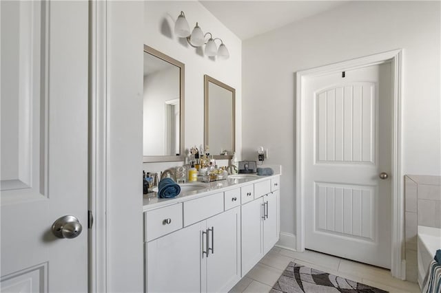 full bathroom with a sink, a tub to relax in, and double vanity