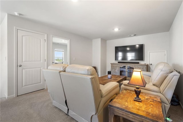 living area featuring light colored carpet and visible vents