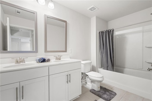 bathroom featuring a sink, visible vents, and tile patterned flooring