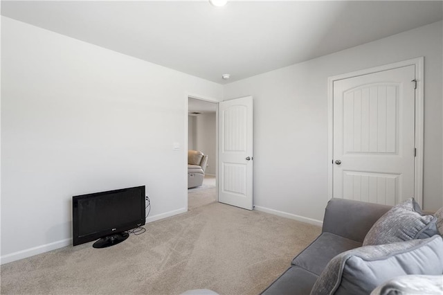 interior space with baseboards and carpet floors