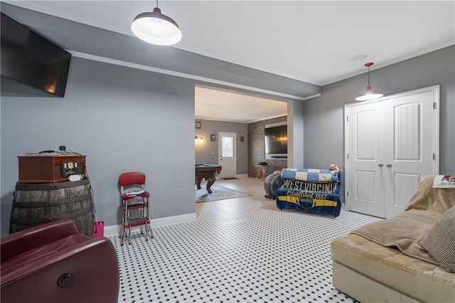 bedroom with pool table, crown molding, light floors, and baseboards