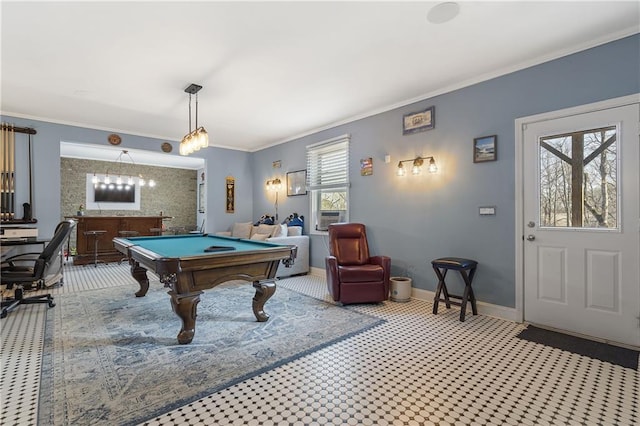 recreation room with pool table, baseboards, indoor bar, and ornamental molding