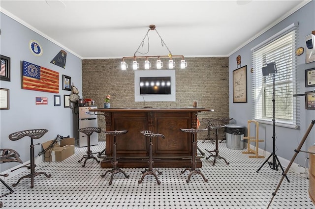 bar with baseboards, brick wall, and crown molding