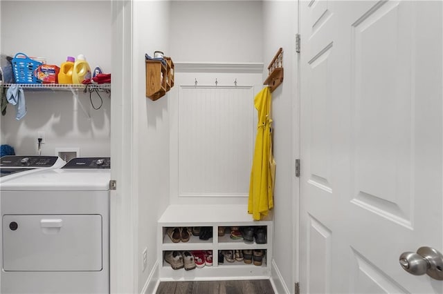 laundry room with laundry area, wood finished floors, baseboards, and washing machine and clothes dryer