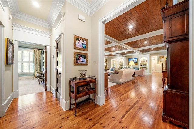 hall featuring crown molding, beamed ceiling, wooden ceiling, and light wood-type flooring