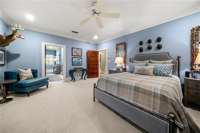 carpeted bedroom featuring ornamental molding and ceiling fan