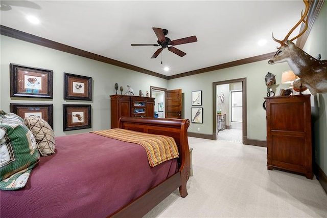 bedroom with ornamental molding, ceiling fan, ensuite bathroom, and carpet floors