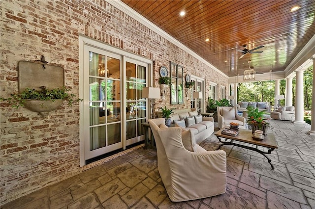 sunroom / solarium with wood ceiling and ceiling fan