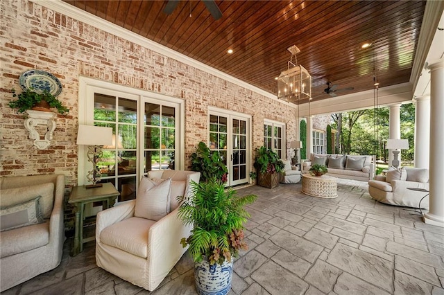 view of terrace with ceiling fan and an outdoor hangout area