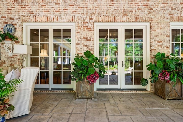 doorway to property with a patio area and french doors