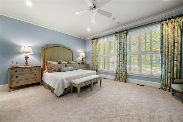 bedroom with ceiling fan, carpet, and crown molding