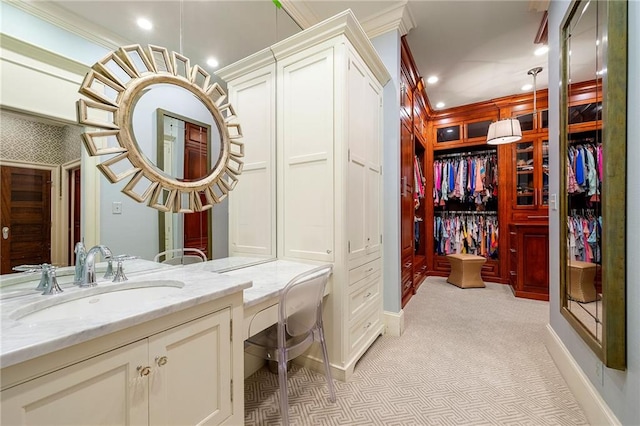 bathroom with tile flooring, crown molding, and large vanity