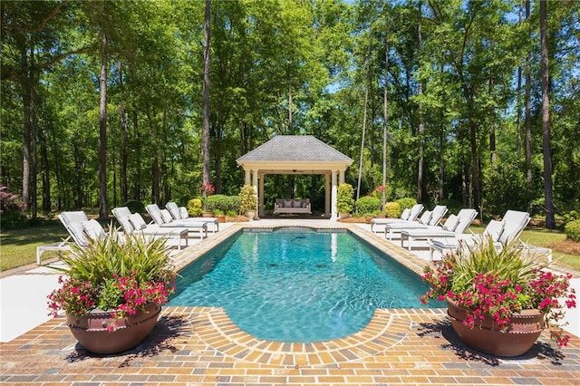 view of swimming pool featuring a patio area and a gazebo