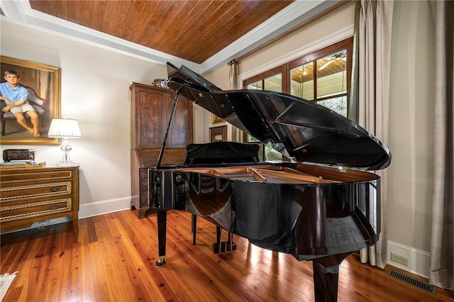 miscellaneous room featuring hardwood / wood-style floors, wooden ceiling, and ornamental molding