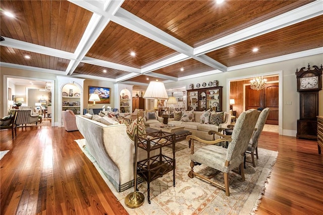 living room with wood-type flooring, coffered ceiling, beamed ceiling, and a chandelier