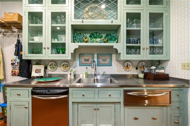 kitchen featuring stainless steel counters, tasteful backsplash, dishwasher, and sink