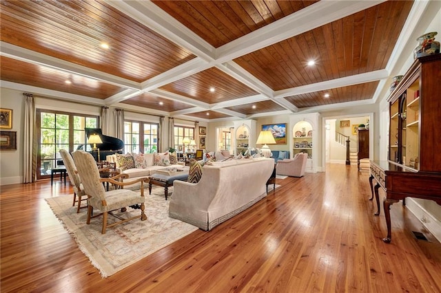 living room with beamed ceiling, wood-type flooring, coffered ceiling, wooden ceiling, and ornamental molding