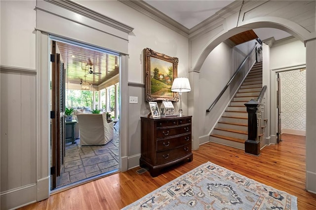 interior space featuring hardwood / wood-style floors and ornamental molding