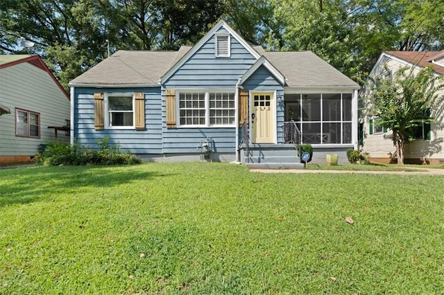 1649 Beecher St SW, Atlanta, GA 30310 - view of front of home featuring a sunroom, a front yard, and a shingled roof