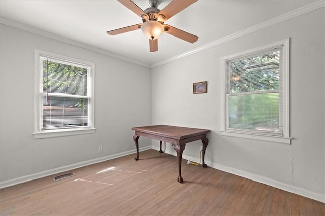 1649 Beecher St SW, Atlanta, GA 30310 - unfurnished room featuring plenty of natural light, light wood finished floors, baseboards, ornamental molding, and a ceiling fan