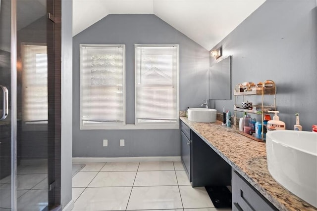 1649 Beecher St SW, Atlanta, GA 30310 - full bathroom featuring double vanity, vaulted ceiling, baseboards, an enclosed shower, and tile patterned flooring