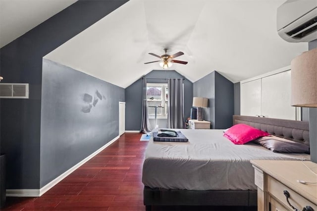 1649 Beecher St SW, Atlanta, GA 30310 - bedroom with an AC wall unit, vaulted ceiling, dark wood-style flooring, baseboards, and ceiling fan