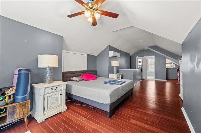 1649 Beecher St SW, Atlanta, GA 30310 - bedroom featuring a wall mounted air conditioner, baseboards, vaulted ceiling, wood finished floors, and ceiling fan