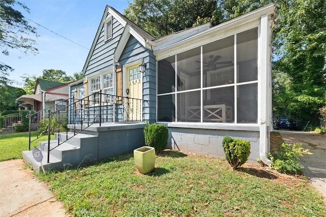 1649 Beecher St SW, Atlanta, GA 30310 - view of home's exterior with a sunroom and a yard
