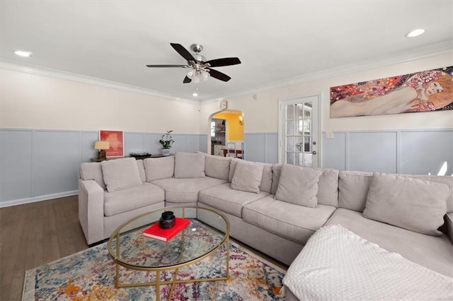 1649 Beecher St SW, Atlanta, GA 30310 - living area featuring arched walkways, ornamental molding, a ceiling fan, wainscoting, and wood finished floors