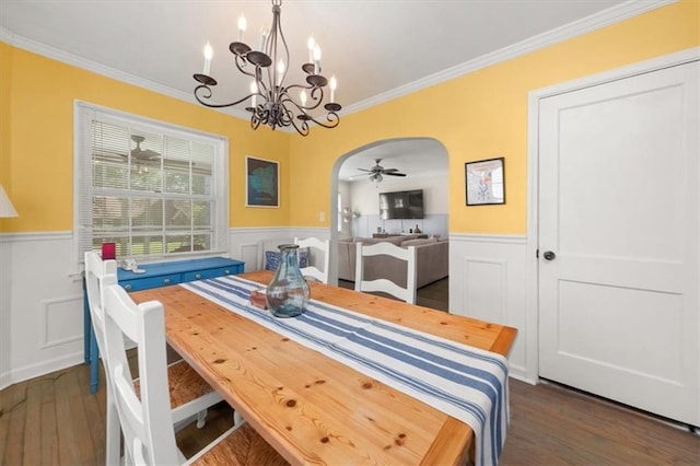 1649 Beecher St SW, Atlanta, GA 30310 - dining space with wainscoting, arched walkways, a chandelier, dark wood-type flooring, and crown molding
