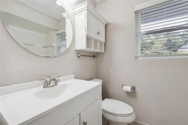 bathroom featuring toilet and vanity