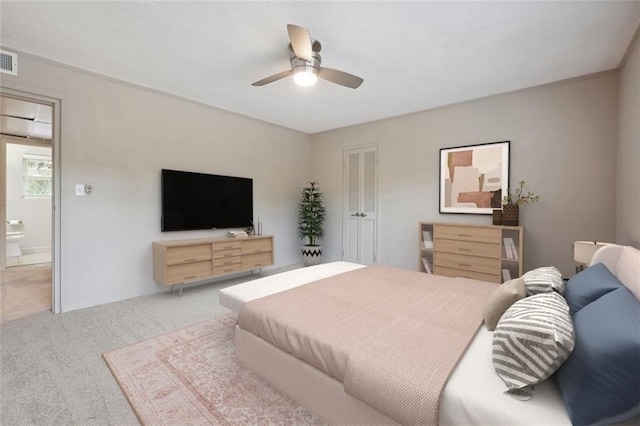 carpeted bedroom featuring visible vents and a ceiling fan