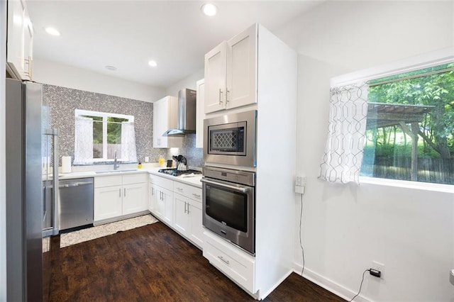 1463 Macklone St NE, Atlanta, GA 30307 - kitchen featuring stainless steel appliances, wall chimney range hood, plenty of natural light, decorative backsplash, and recessed lighting