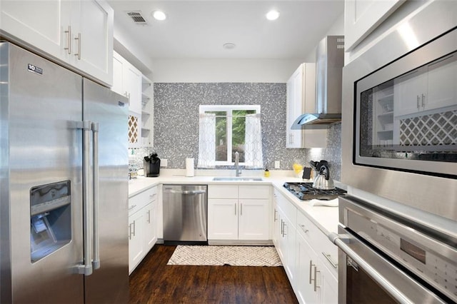 1463 Macklone St NE, Atlanta, GA 30307 - kitchen with stainless steel appliances, wall chimney exhaust hood, dark wood-style flooring, backsplash, and recessed lighting