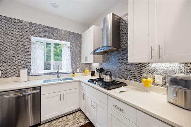 1463 Macklone St NE, Atlanta, GA 30307 - kitchen with stainless steel appliances, wall chimney exhaust hood, light countertops, white cabinetry, and tasteful backsplash