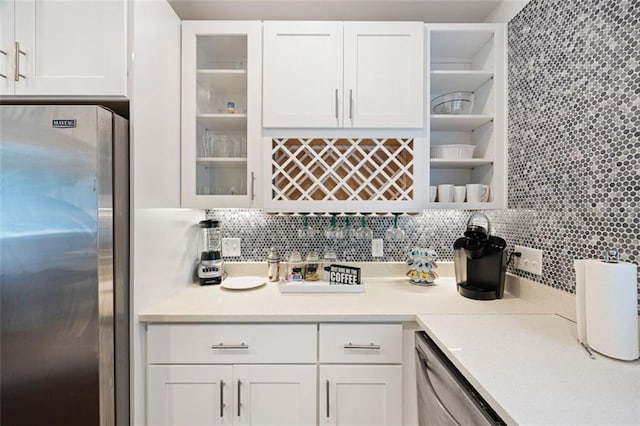 1463 Macklone St NE, Atlanta, GA 30307 - kitchen featuring appliances with stainless steel finishes, white cabinetry, backsplash, and glass insert cabinets
